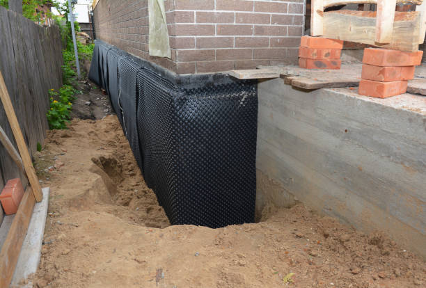 Happy homeowners after waterproofing job in Arab
